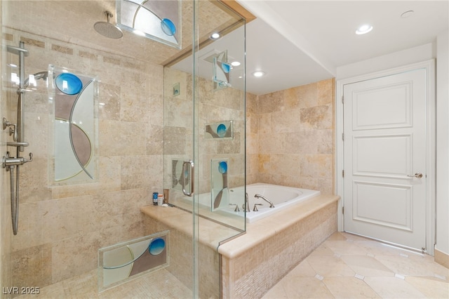 bathroom featuring tile patterned flooring and independent shower and bath