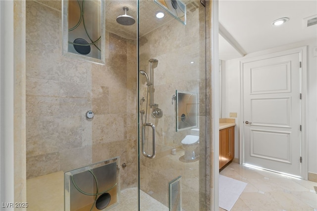 bathroom featuring vanity and an enclosed shower