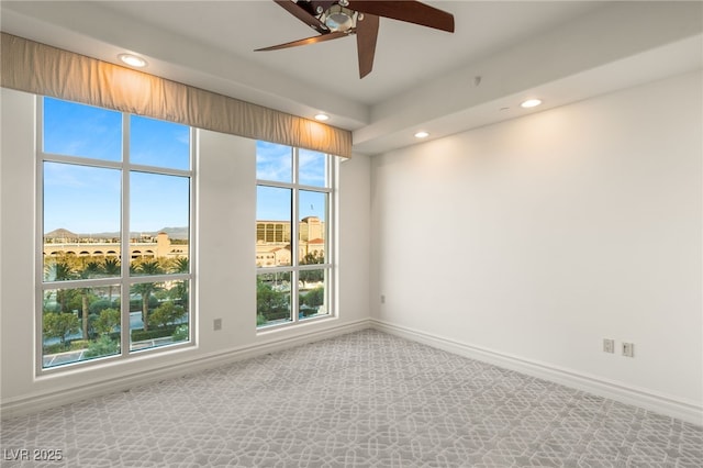 unfurnished room featuring ceiling fan