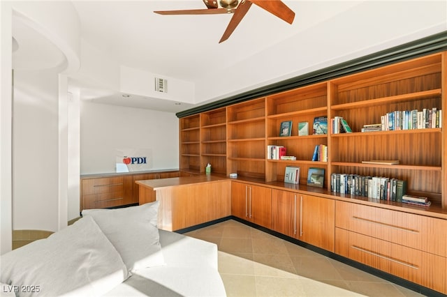 interior space featuring ceiling fan