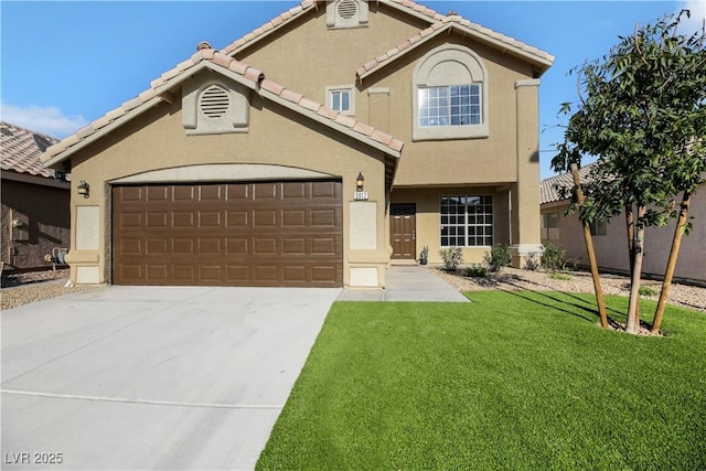 view of front of property featuring a front yard and a garage