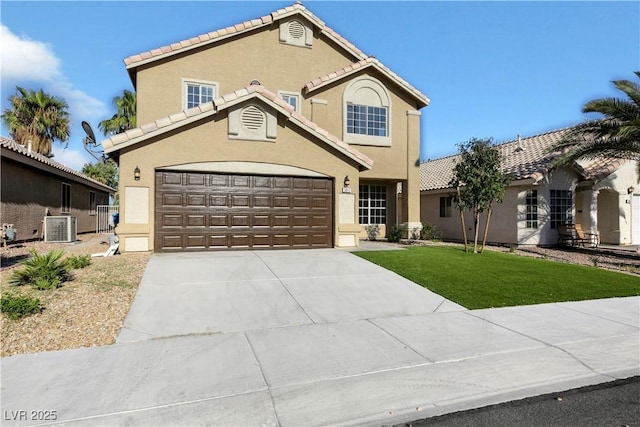 view of front of house featuring central AC, a garage, and a front yard