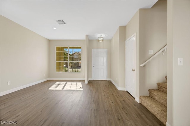 entryway with dark hardwood / wood-style floors