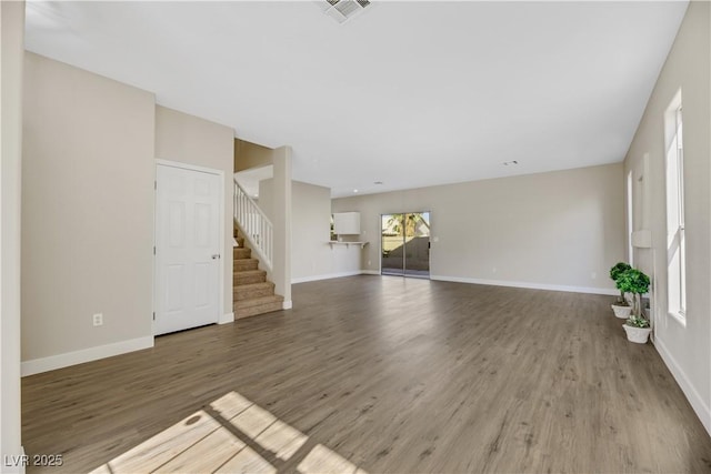 unfurnished living room with hardwood / wood-style floors