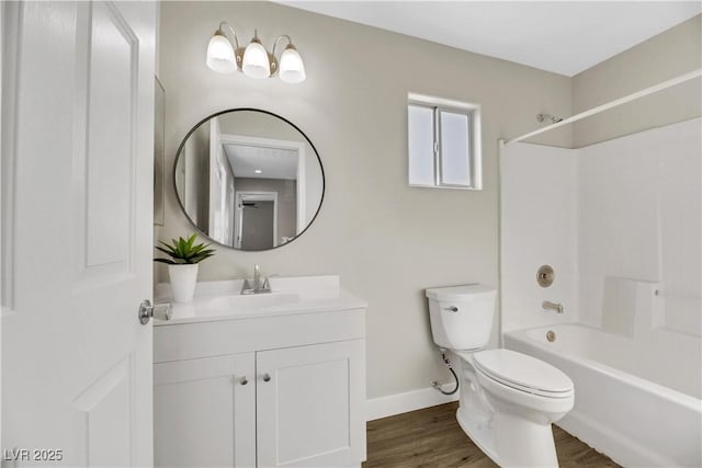 full bathroom featuring toilet, washtub / shower combination, vanity, and hardwood / wood-style floors