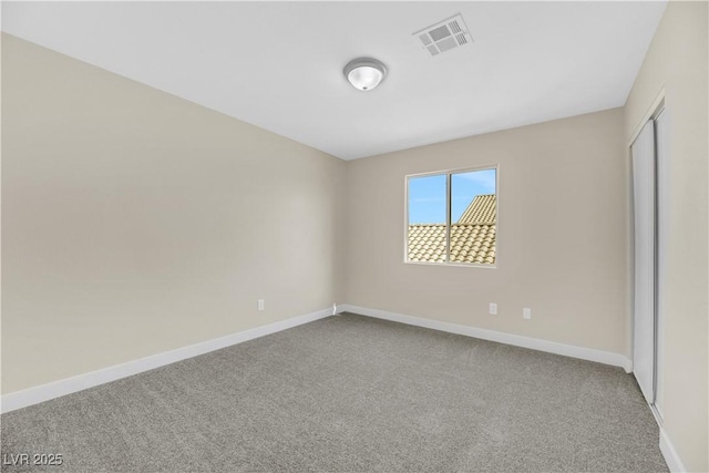 unfurnished bedroom featuring a closet and carpet