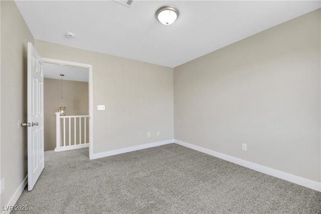 unfurnished room featuring carpet floors