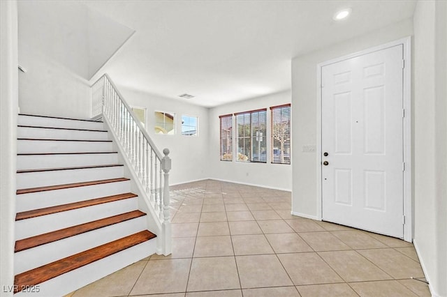 foyer featuring light tile patterned flooring