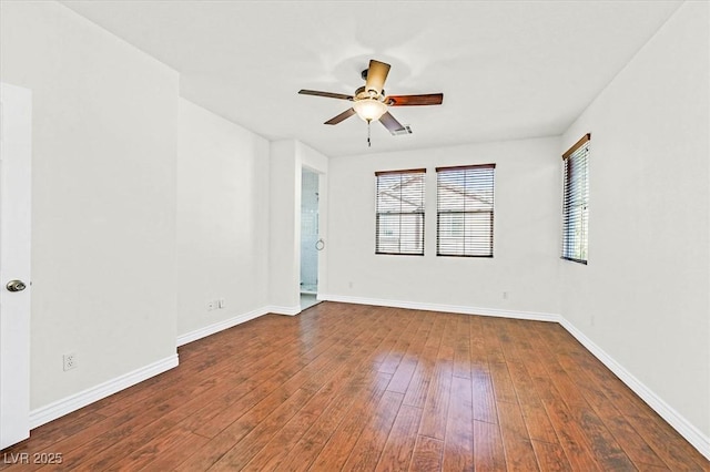 empty room featuring ceiling fan and hardwood / wood-style flooring