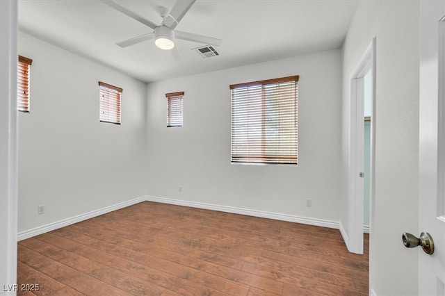 empty room featuring ceiling fan and wood-type flooring