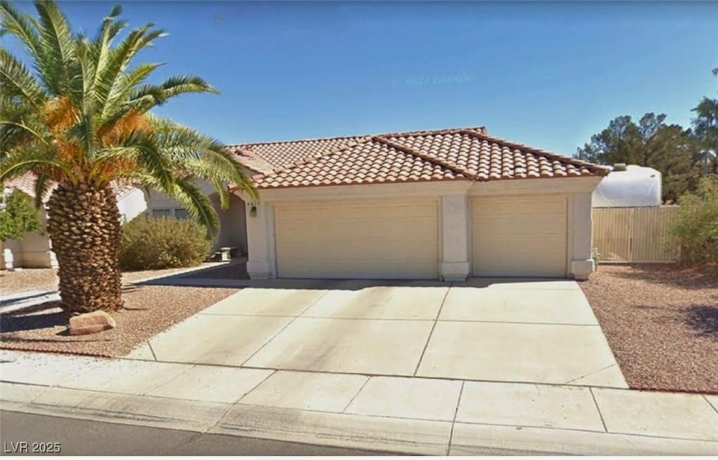 mediterranean / spanish-style house featuring a garage