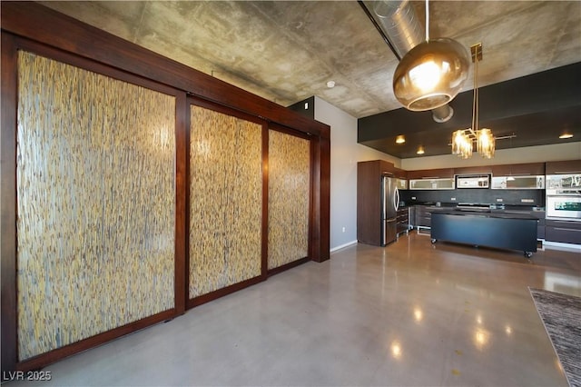 kitchen featuring stainless steel fridge and wall oven