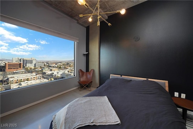 bedroom featuring carpet floors and a notable chandelier