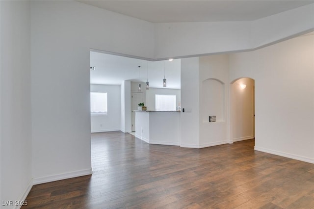 unfurnished room with dark hardwood / wood-style floors