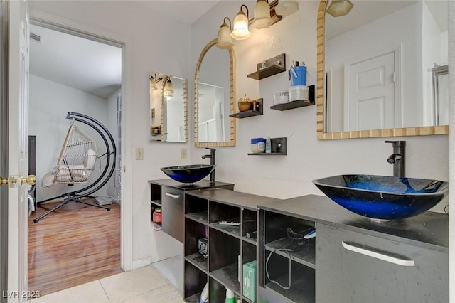 bathroom featuring vanity and tile patterned flooring