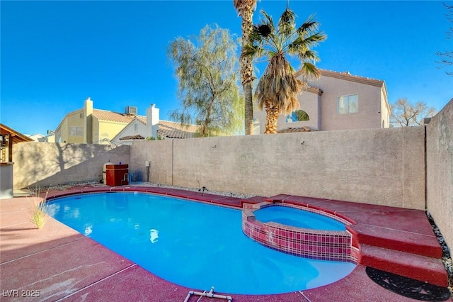 view of pool featuring an in ground hot tub