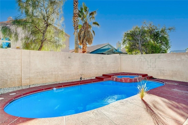 view of pool featuring an in ground hot tub