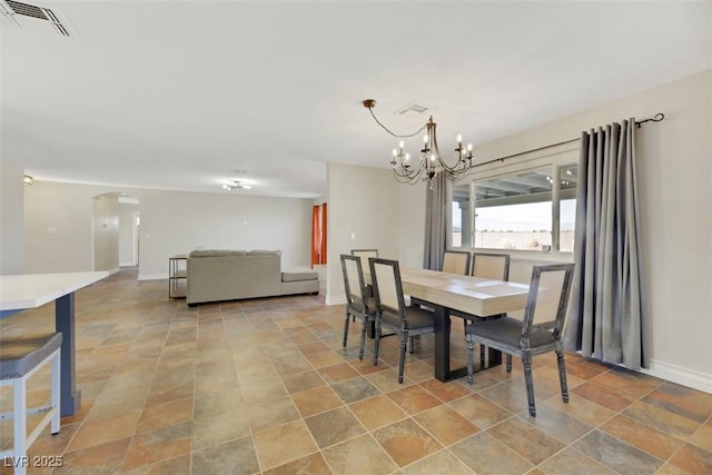 dining space featuring a chandelier