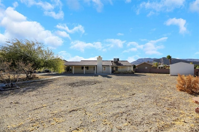 view of front of home with a mountain view