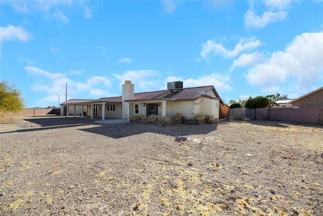 rear view of house with a patio area and central air condition unit