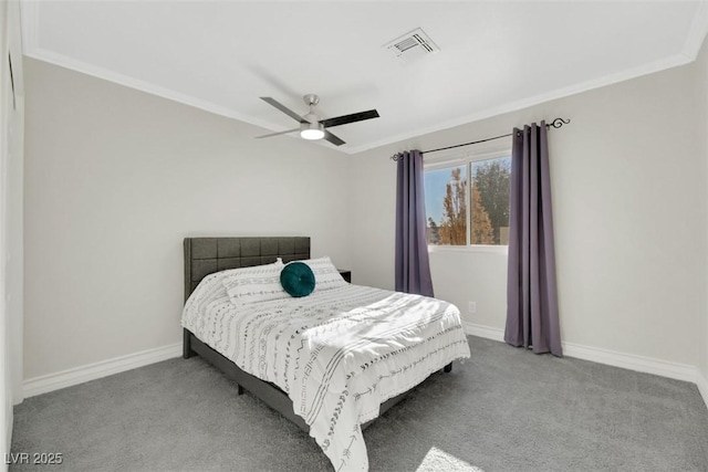 bedroom with ceiling fan, crown molding, and carpet floors