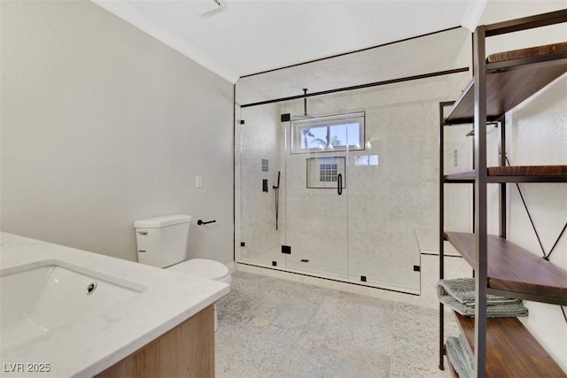 bathroom featuring toilet, vanity, an enclosed shower, and crown molding