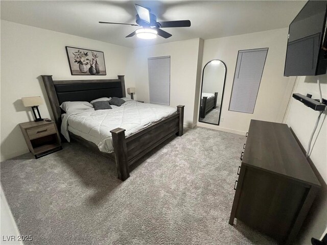 bedroom with ceiling fan and light carpet