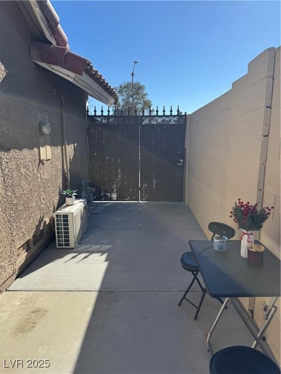 view of patio featuring ac unit