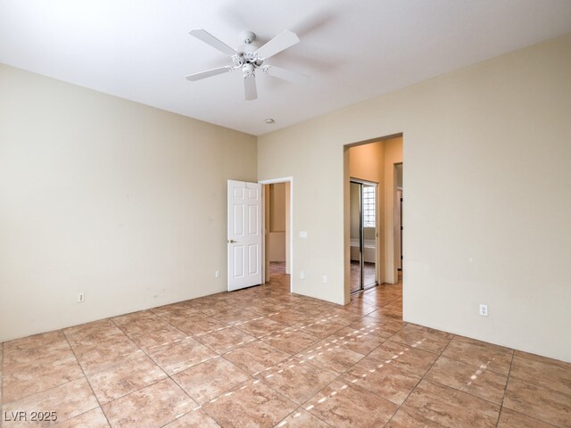 unfurnished room featuring ceiling fan