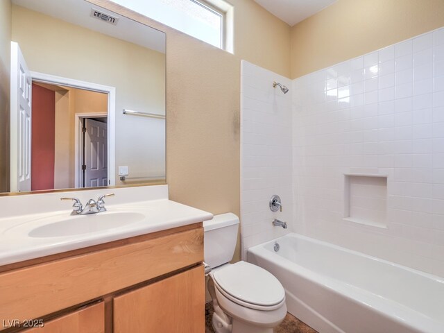 full bathroom featuring toilet, bathing tub / shower combination, and vanity