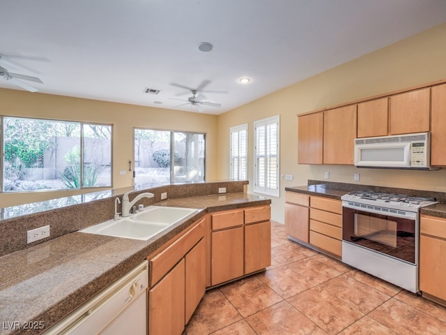 kitchen with ceiling fan, light tile patterned floors, sink, and white appliances