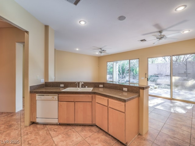 kitchen with white dishwasher, sink, kitchen peninsula, and ceiling fan