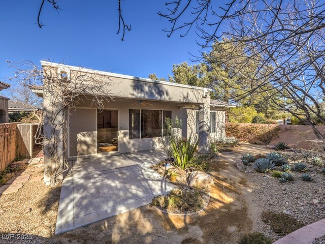 view of front of home with ceiling fan and a patio