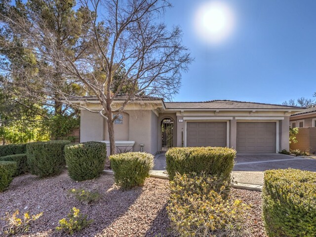 ranch-style home with a garage