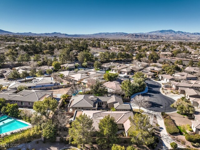 birds eye view of property with a mountain view