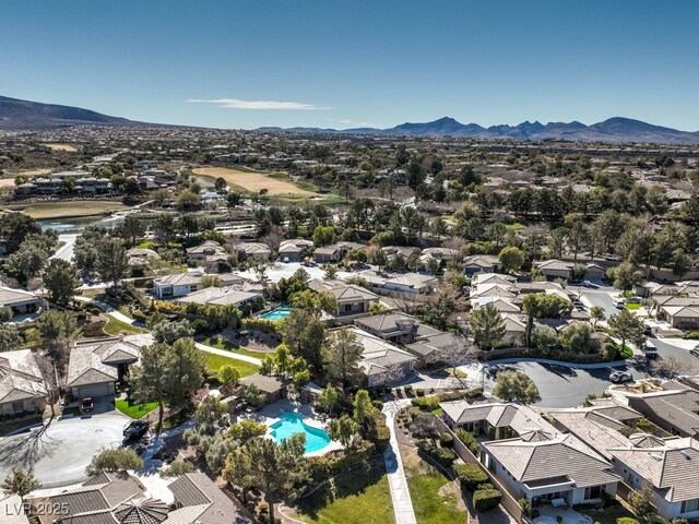 birds eye view of property with a mountain view