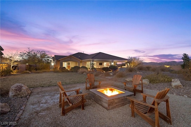 patio terrace at dusk with a fire pit