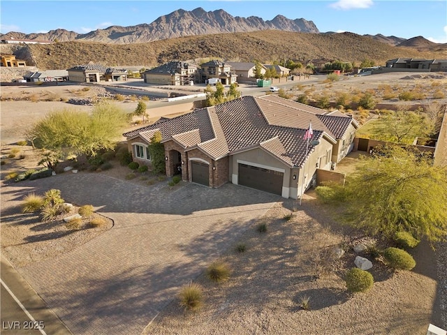 birds eye view of property featuring a mountain view