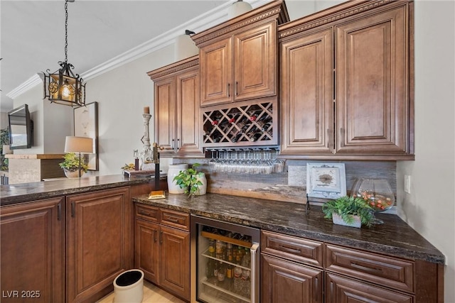 bar with backsplash, decorative light fixtures, dark stone countertops, beverage cooler, and crown molding