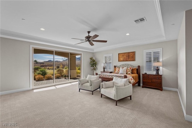 bedroom featuring ceiling fan, access to outside, a raised ceiling, ornamental molding, and light carpet