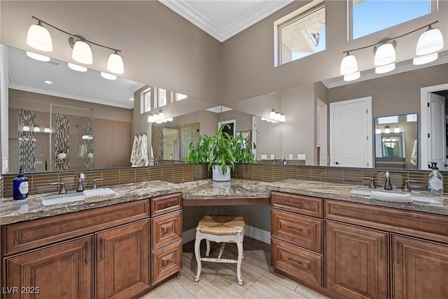 bathroom with a towering ceiling, tile patterned flooring, vanity, a shower, and crown molding