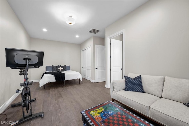 bedroom with a closet and wood-type flooring