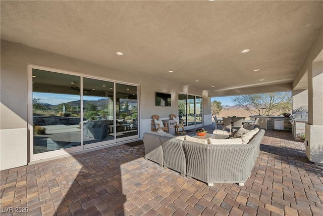 view of patio / terrace with area for grilling and outdoor lounge area