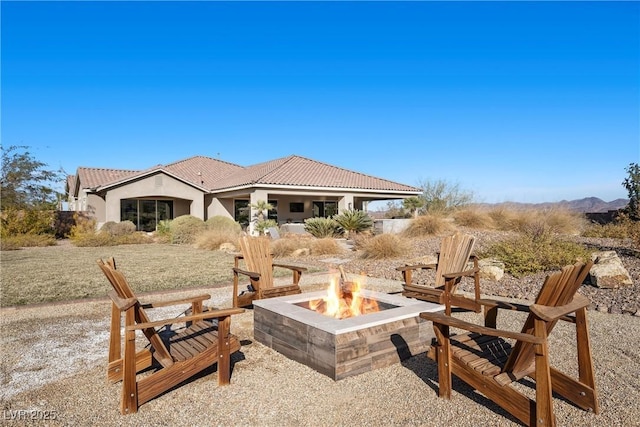 view of patio featuring a fire pit