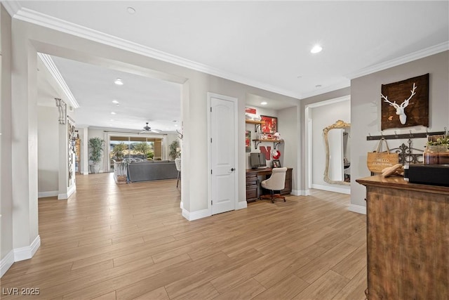 interior space with ornamental molding and light hardwood / wood-style flooring