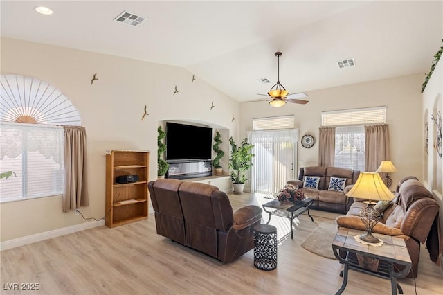 living room with vaulted ceiling, ceiling fan, and light hardwood / wood-style floors