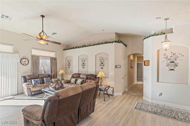 living room featuring ceiling fan, light hardwood / wood-style floors, and lofted ceiling