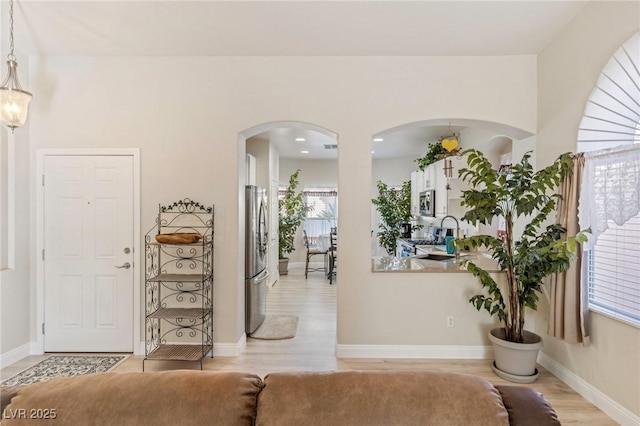 entrance foyer with light hardwood / wood-style floors