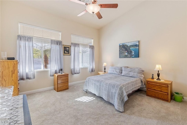 bedroom with lofted ceiling, light carpet, and ceiling fan