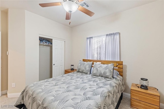 bedroom with ceiling fan, a closet, and carpet